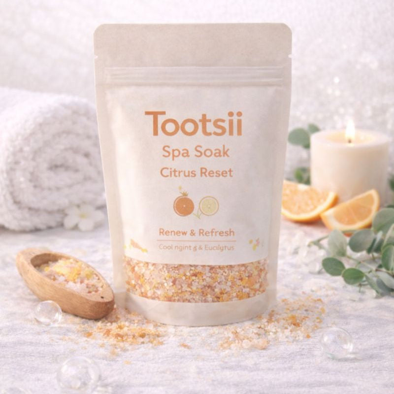 Tootsii Spa Soak Citrus Reset packaging on a white surface with spa elements.