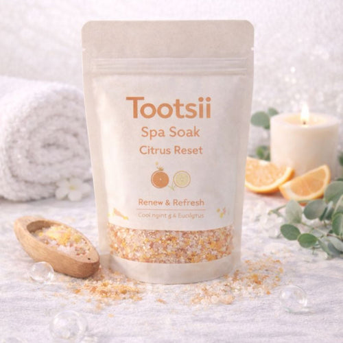Tootsii Spa Soak Citrus Reset packaging on a white surface with spa elements.